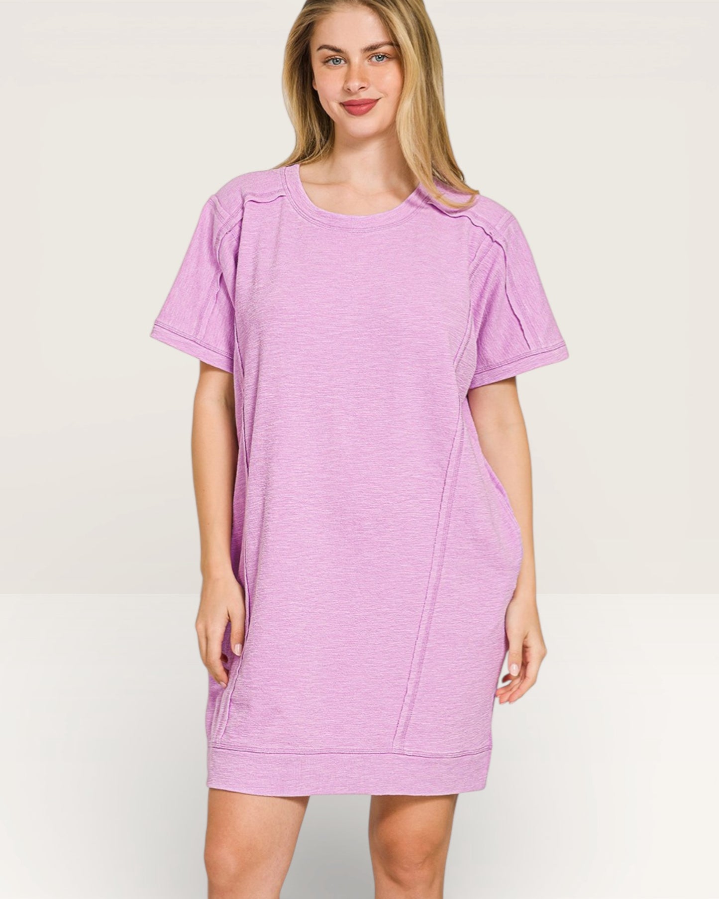 Woman wearing a purple dress on a white background