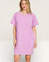 Woman wearing a purple dress on a white background