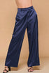 Navy satin wide-leg pants on a beige background