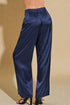 Navy satin pants on a beige background