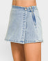 Light blue denim skirt worn by a person on a plain background