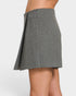 Gray skirt worn by a person on a white background