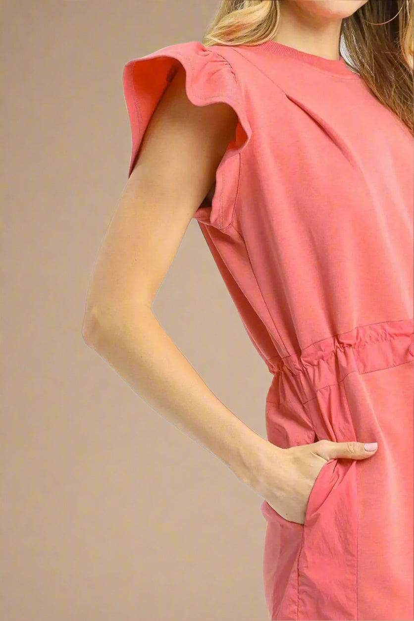 Coral dress with ruffled sleeves on a white background