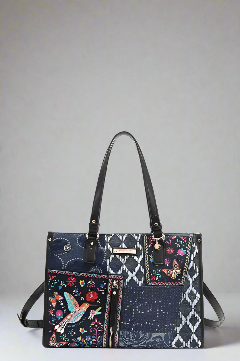 Multicolored handbag with floral and geometric patterns on a white background