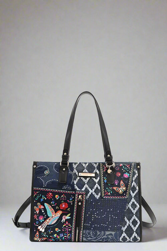 Multicolored handbag with floral and geometric patterns on a white background