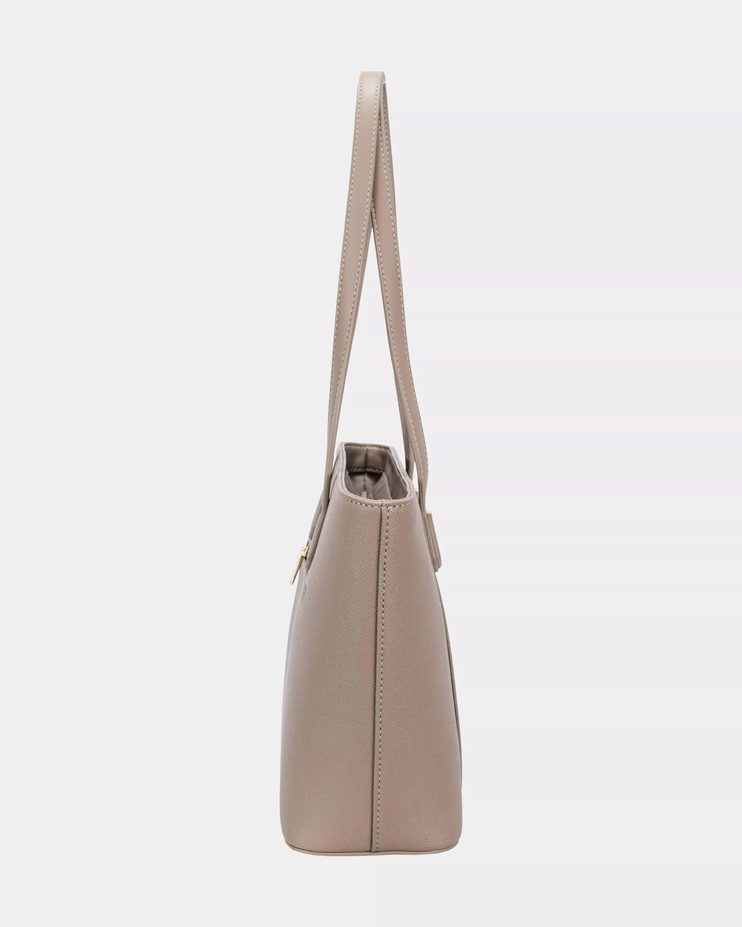 Beige handbag with a strap on a light gray background