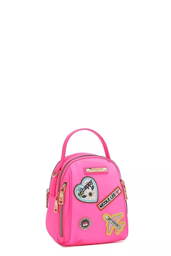 Pink backpack with patches on a white background