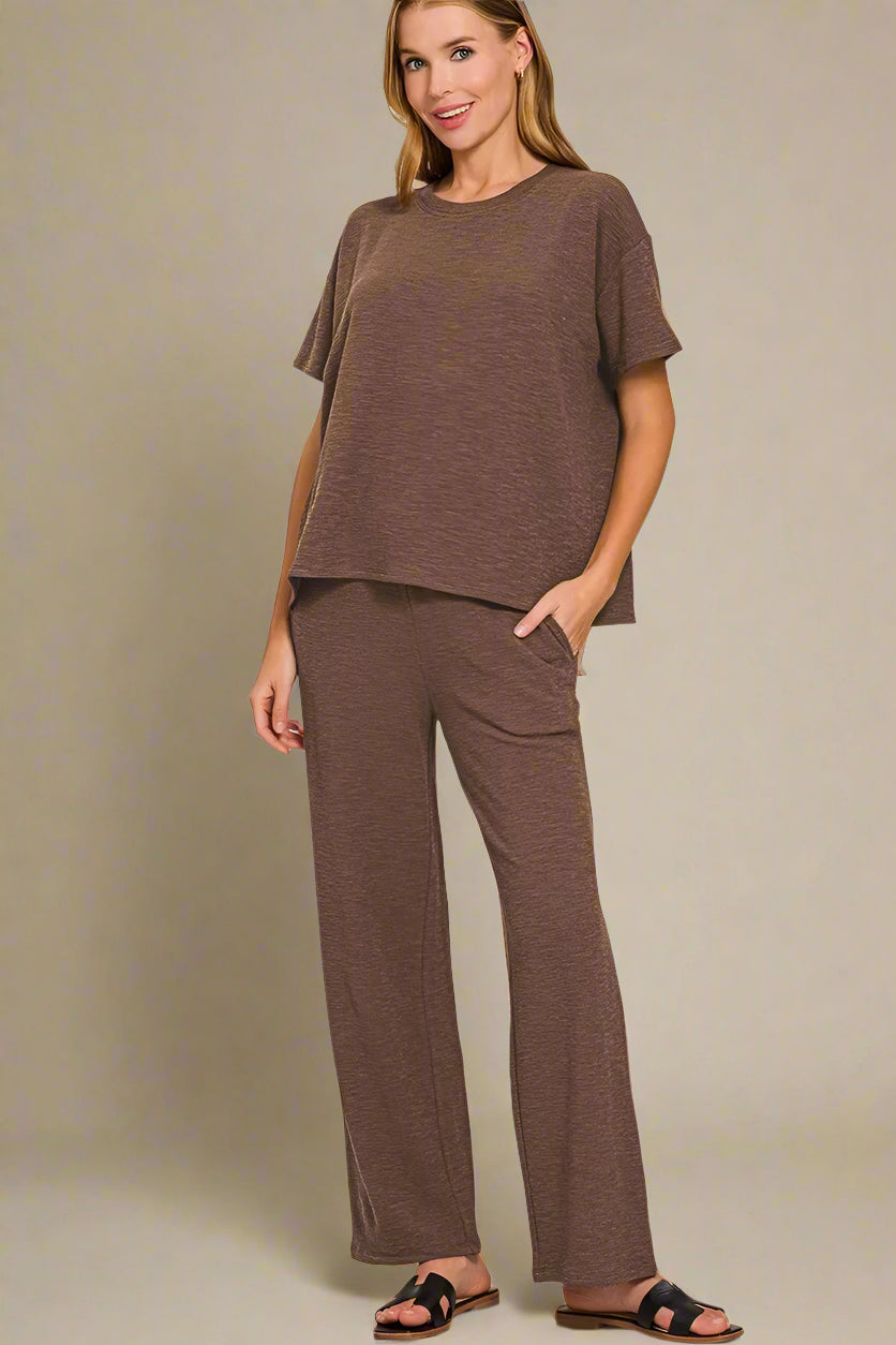 Woman wearing a brown outfit on a white background