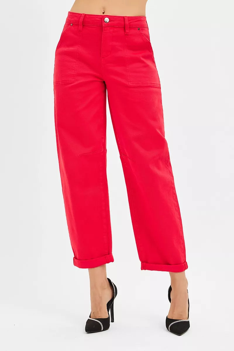 Red pants worn by a person on a white background
