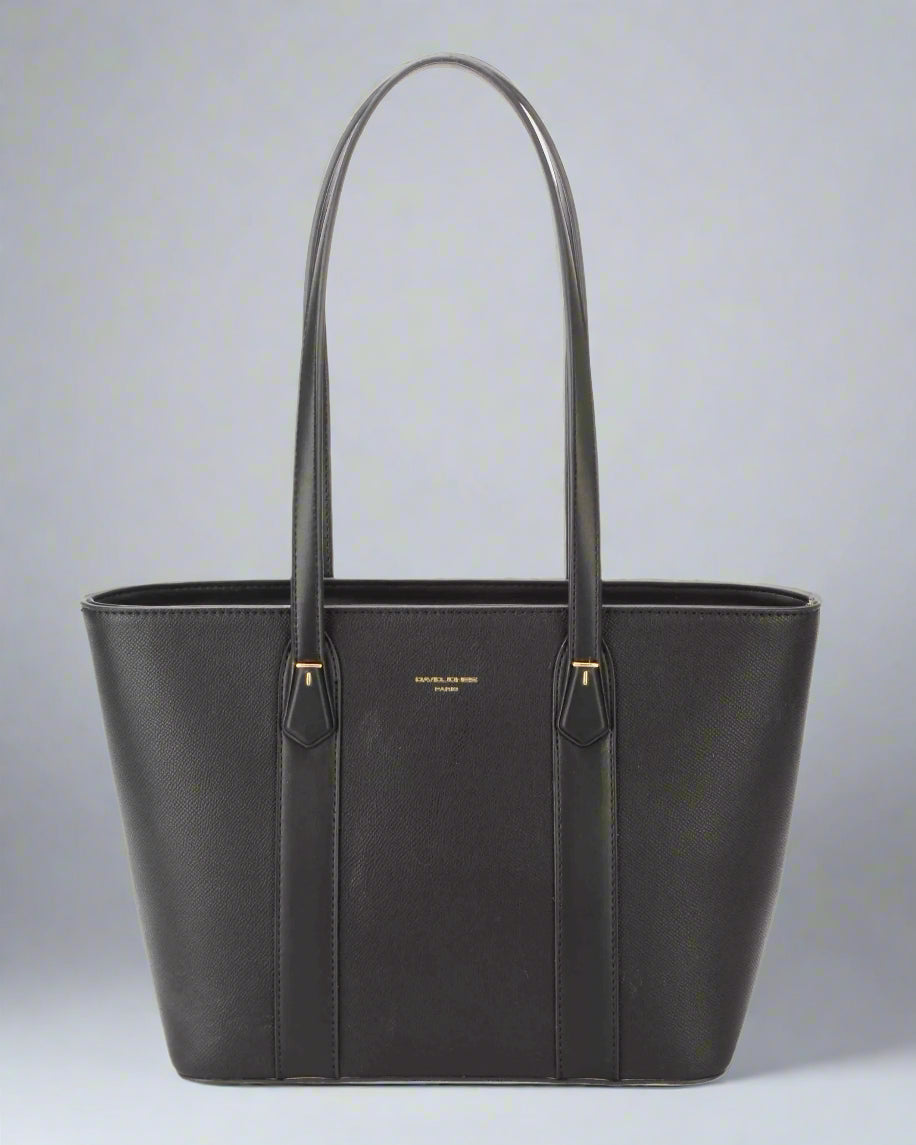 Black tote bag with gold accents on a light gray background
