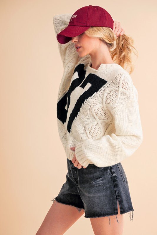 AEMI+CO - White Number 87 Cable Knit Sweater