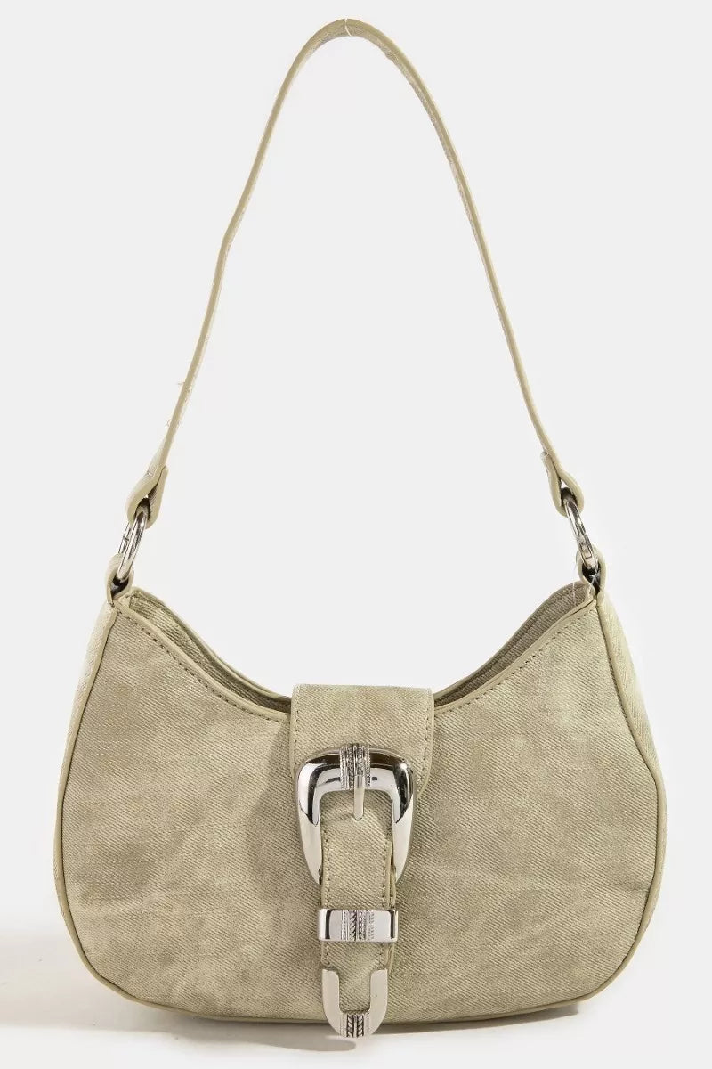 Beige handbag with a silver buckle on a white background