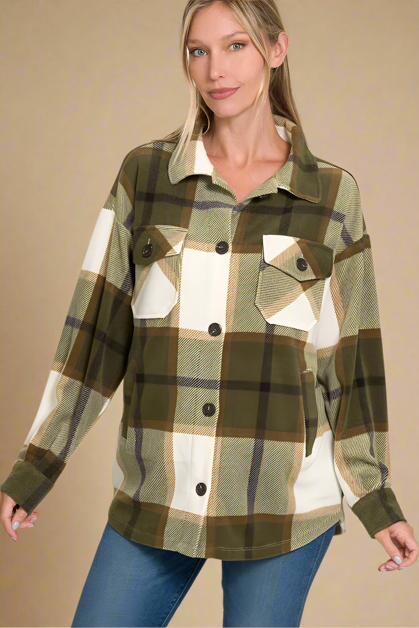 Woman wearing a plaid shirt with a beige background