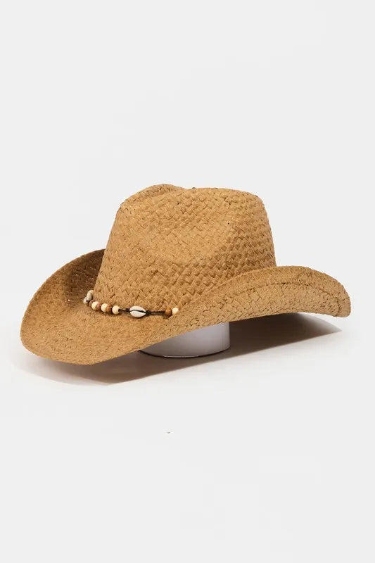 Brown straw cowboy hat with decorative band on a white background