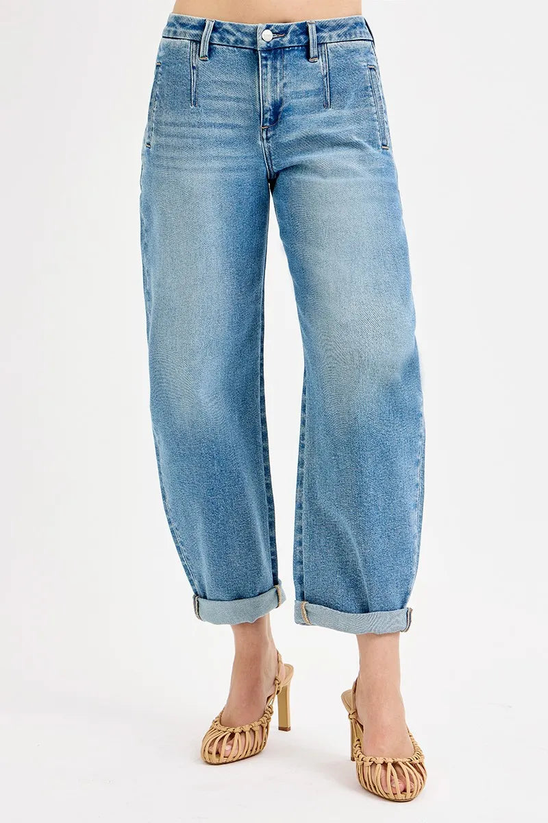 Light blue jeans worn by a person on a white background