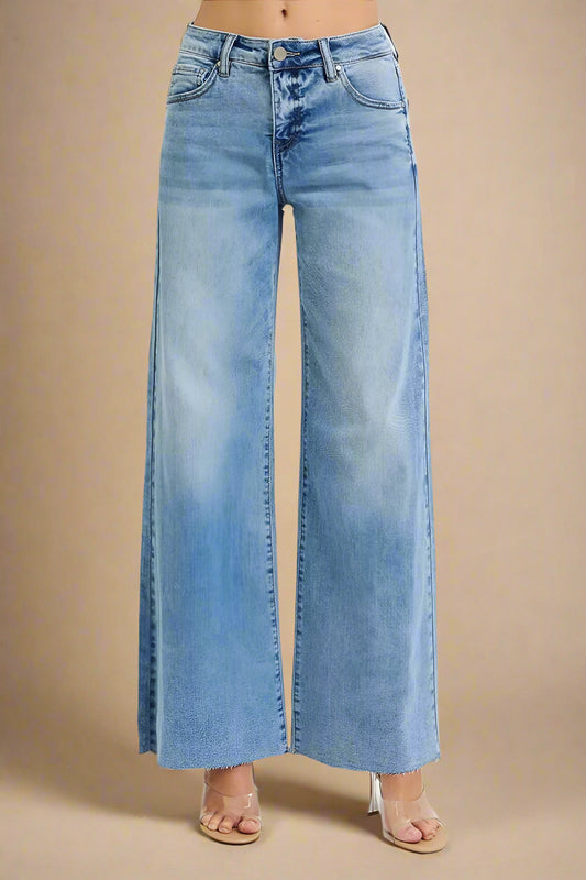 Light blue wide-leg jeans on a beige background