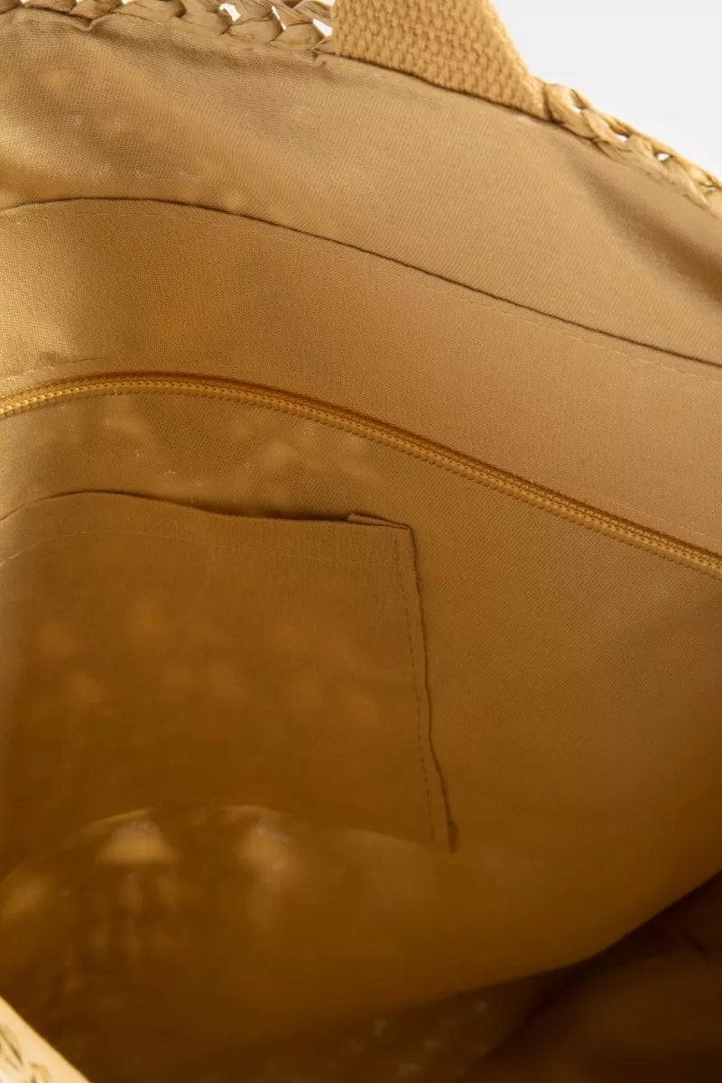 Close-up of a brown leather bag with a zipper