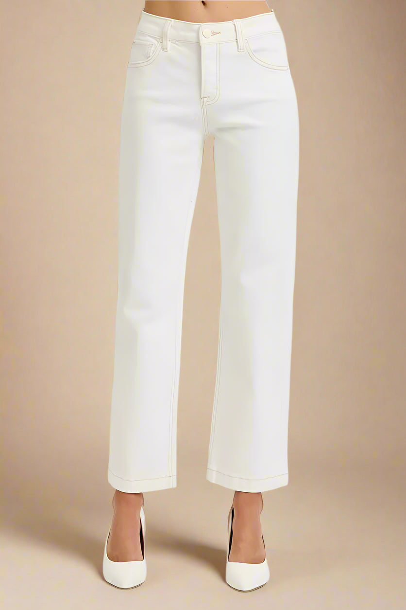 White jeans on a beige background