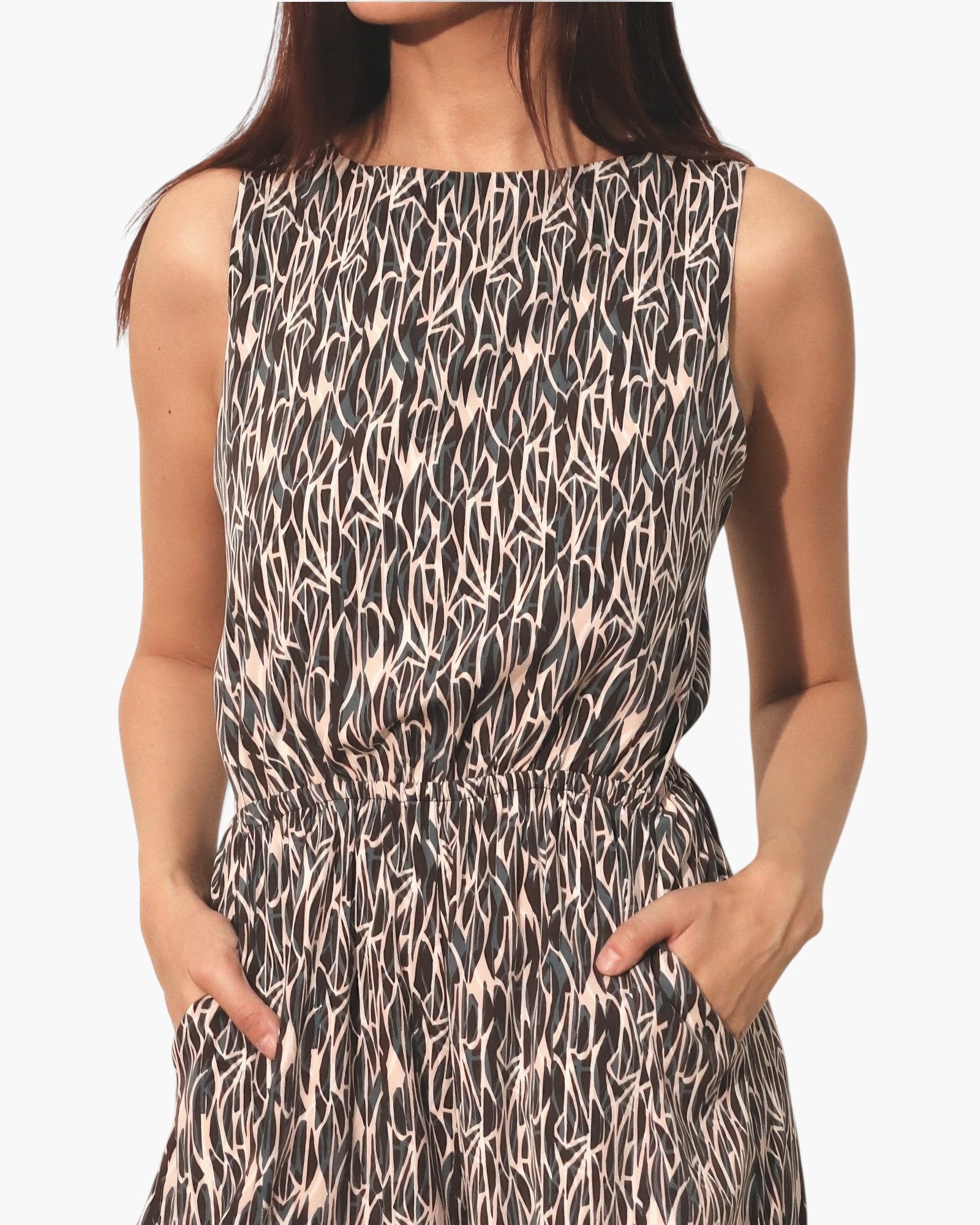 Beach Rose Co. sleeveless bubble jumpsuit in a black and beige abstract print with a relaxed, flowy silhouette.