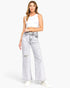 Beach Rose Co. high-rise wide-leg jeans in acid grey wash with subtle distressing, worn by a model with a white top.