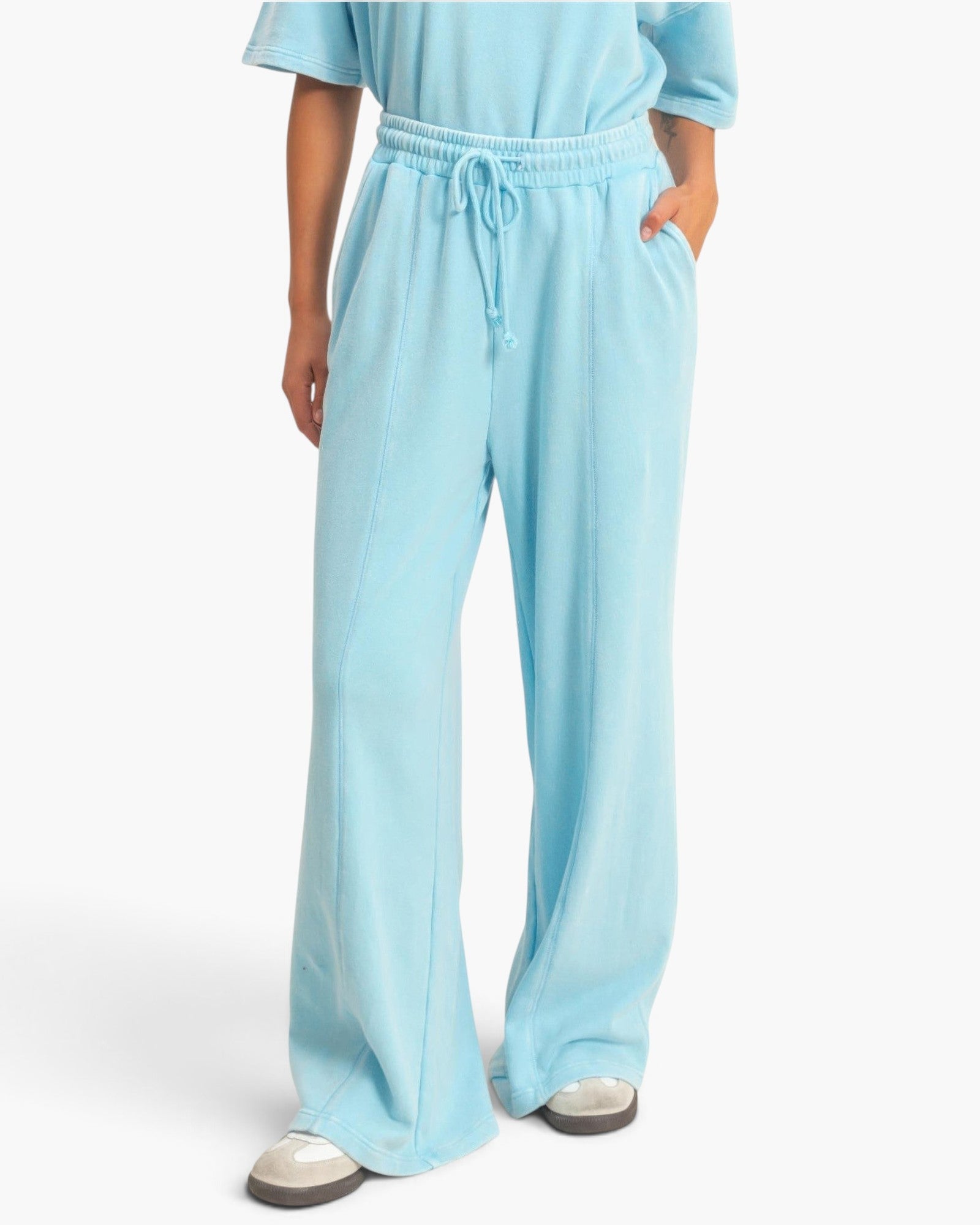 Beach Rose Co. light blue acid wash French terry wide-leg pants with a high-rise drawstring waist and center seams.