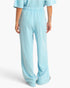 Beach Rose Co. light blue acid wash French terry wide-leg pants with an elastic drawstring waistband, back view.