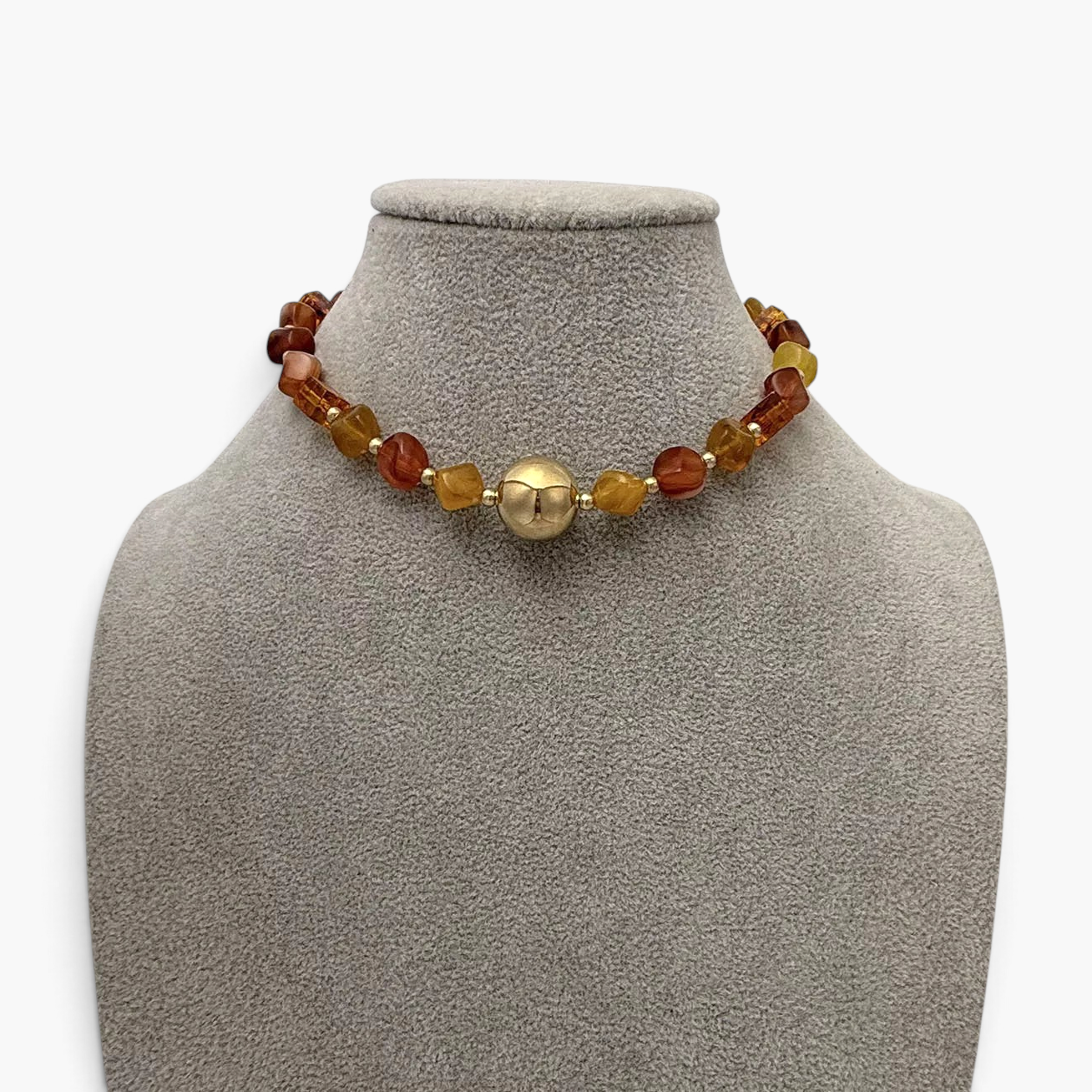Beach Rose Co. 18K gold-plated necklace featuring amber-tone resin beads and a polished gold-tone center bead.