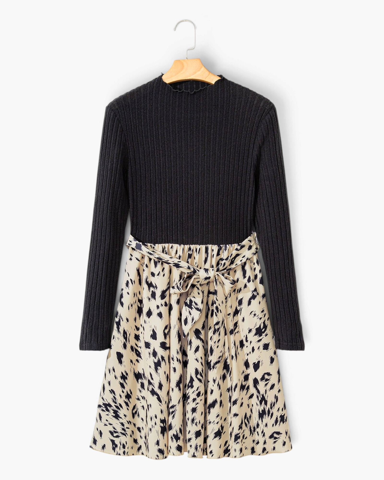 Beach Rose Co. black ribbed mock neck long sleeve dress with a beige animal print flared skirt and waist tie.