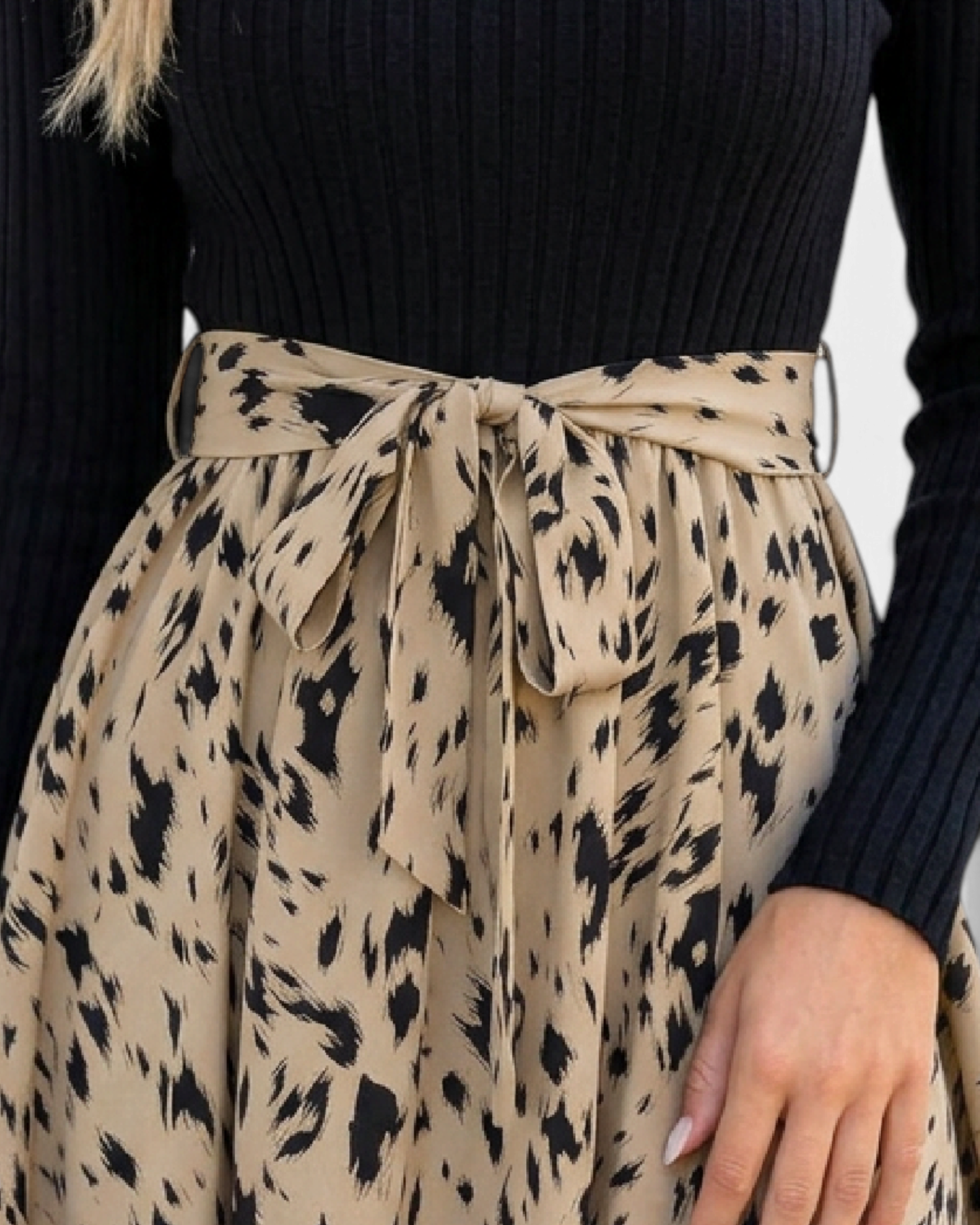 Beach Rose Co. dress featuring a black ribbed long-sleeve bodice and a beige animal print skirt with a waist tie.