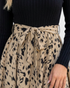 Beach Rose Co. dress featuring a black ribbed long-sleeve bodice and a beige animal print skirt with a waist tie.