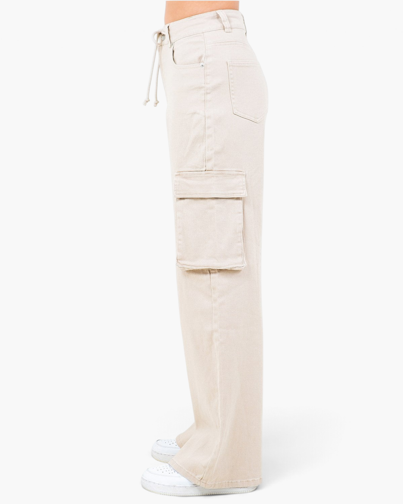 Side view of Beach Rose Co. apricot wide leg cargo pants featuring flap pockets and a drawstring waist.