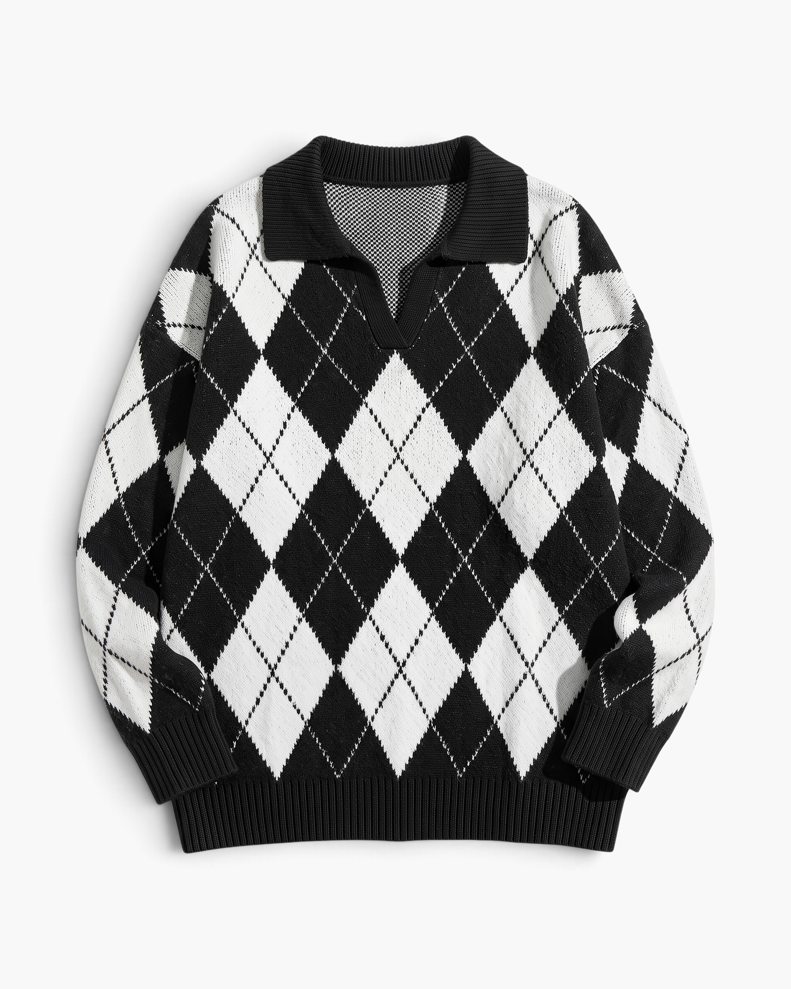 Beach Rose Co. black and white argyle sweater with a fold-over collar, V-neckline, and relaxed fit.