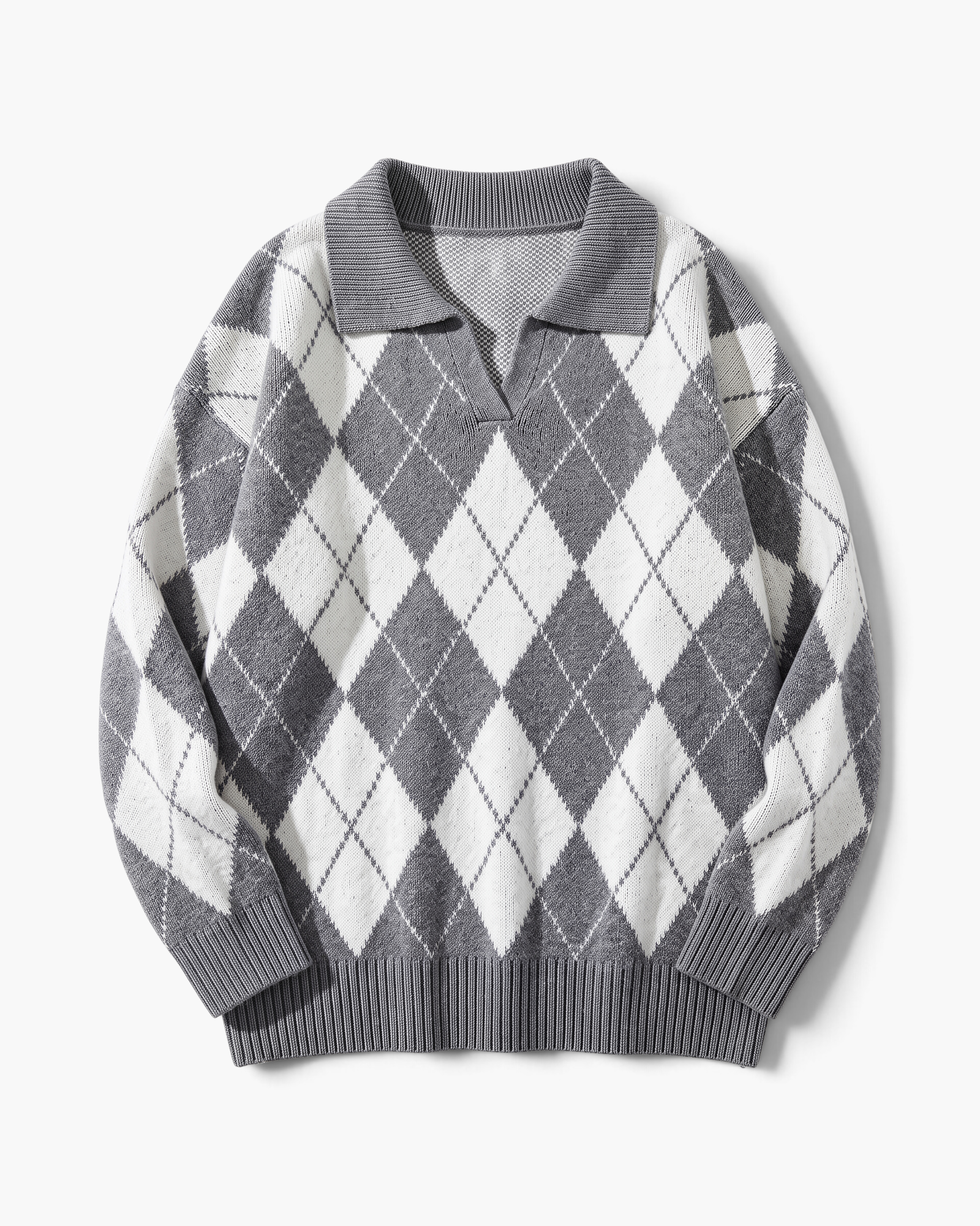 Beach Rose Co. grey and white argyle sweater with a fold-over collar, V-neckline, and relaxed fit.