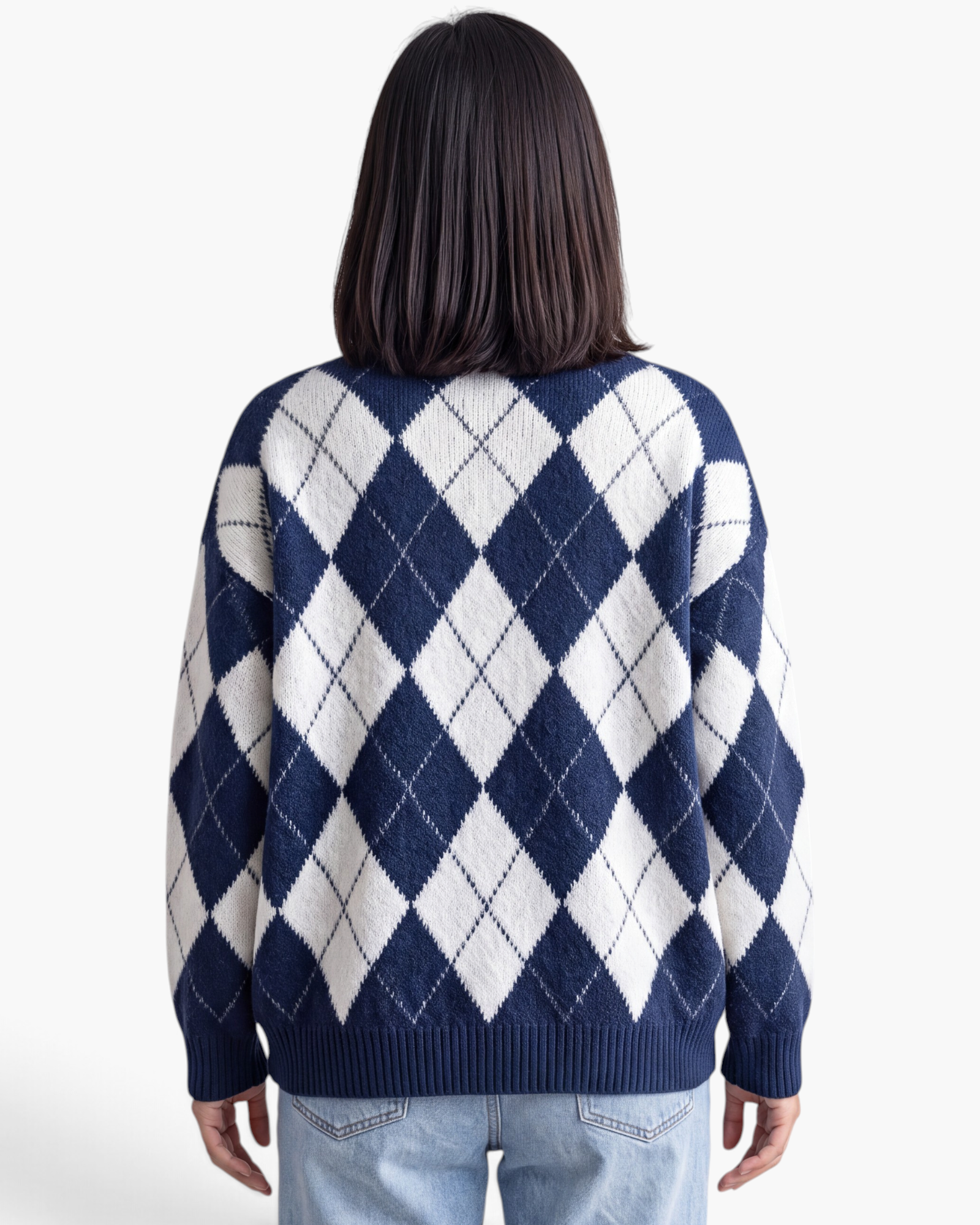 Beach Rose Co. relaxed fit navy and white argyle sweater with a ribbed hem worn by a model, back view.