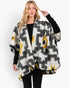 Beach Rose Co. fuzzy Aztec open-front ruana with a geometric pattern and dimensional trim on a model