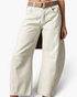 Beach Rose Co. cream barrel leg jeans with knee darts and curved seams worn with a brown leather belt.