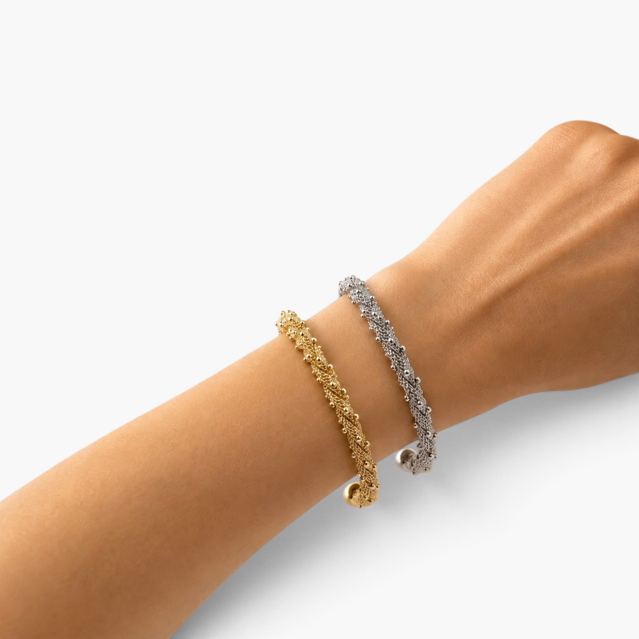 Beach Rose Co. gold and rhodium beaded mesh open cuff bracelets worn on a wrist, featuring fine textured metal.