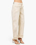 Beach Rose Co. high-rise beige barrel-leg jeans with structured seams and cuffed hems worn with clear heeled sandals.