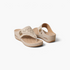 Beach Rose Co. beige thong wedge sandals with decorative laser-cut details, gold accents, and a quilted footbed.