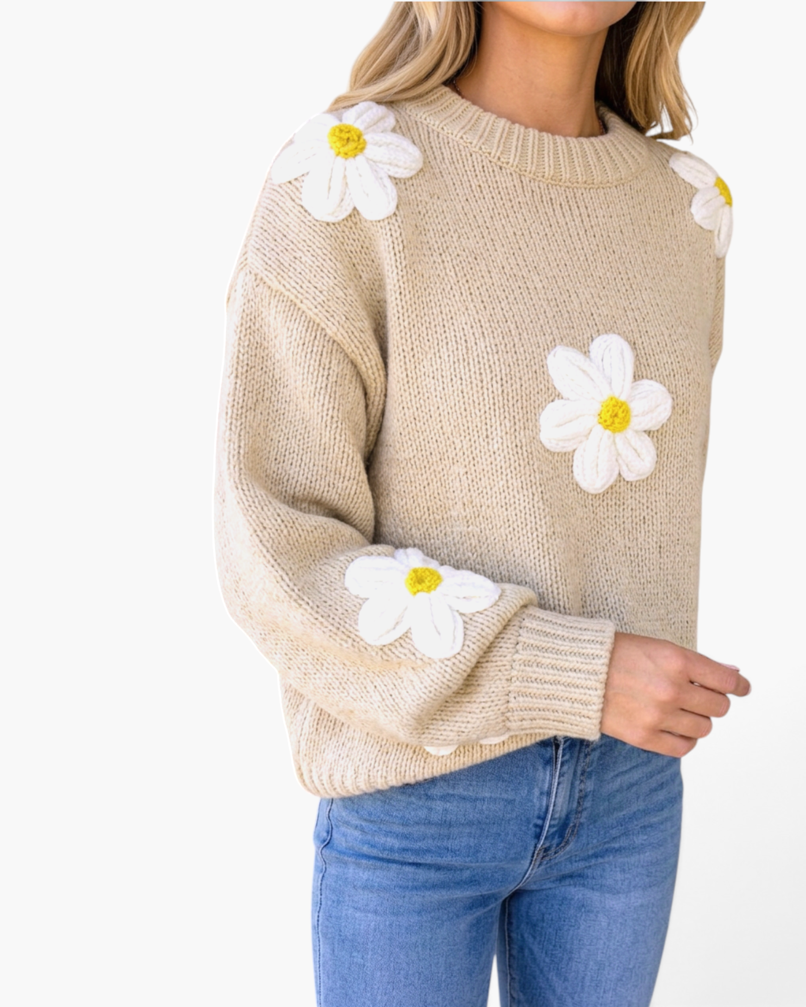 Beach Rose Co. beige knit sweater featuring dimensional white daisy appliqués with yellow centers and a crew neckline.
