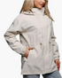Beach Rose Co. beige hooded jacket with drawstring waist, zip front, and snap placket worn by a blonde woman.