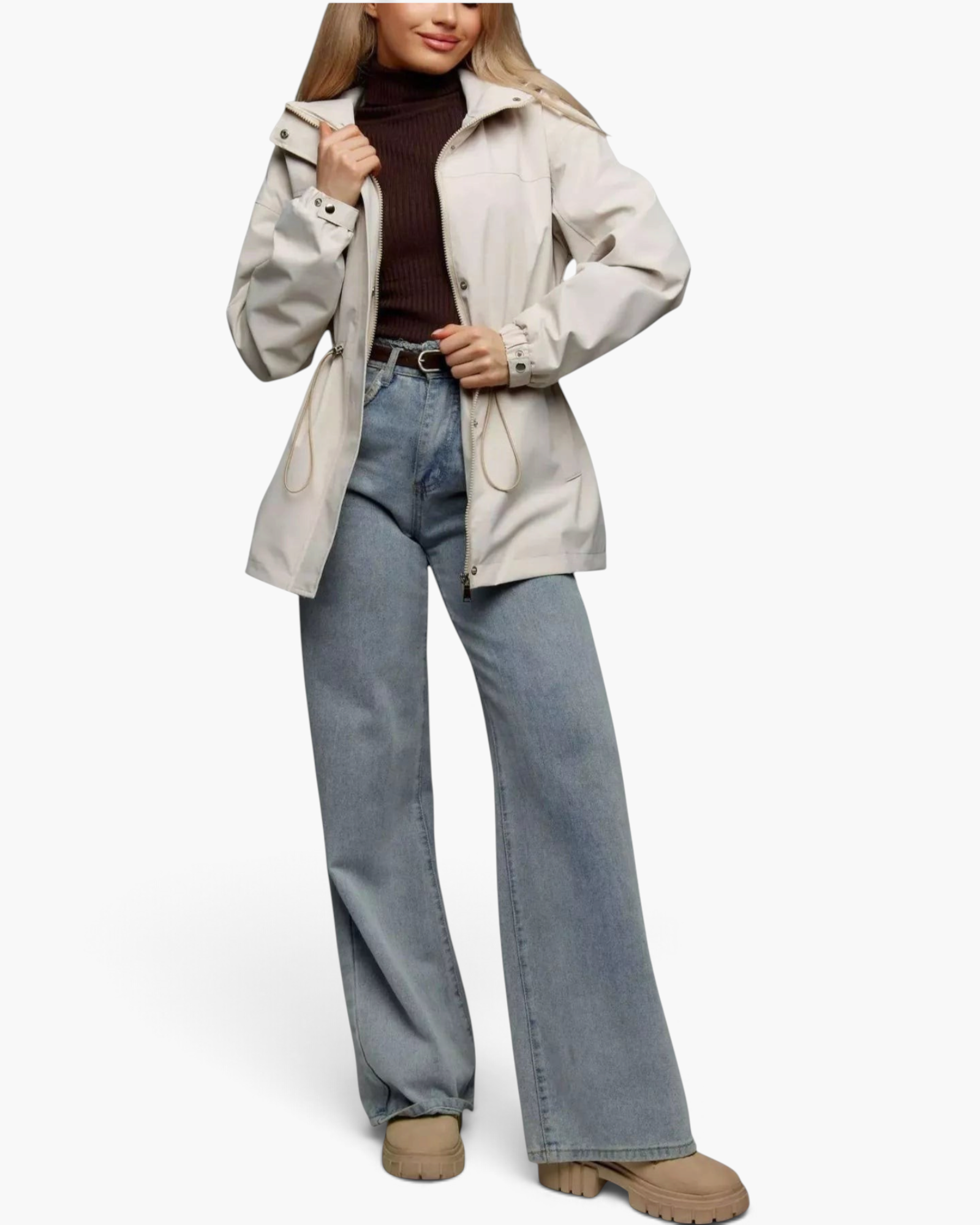 Beach Rose Co. beige hooded jacket with drawstring waist, zip front, and snap placket worn by a model with jeans.