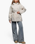 Beach Rose Co. beige hooded jacket with drawstring waist, zip front, and snap placket worn with wide-leg jeans