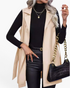 Beach Rose Co. beige faux leather longline vest with notched lapels and a matching waist tie.
