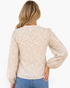 Beach Rose Co. beige blouse with cream raised floral texture, long balloon sleeves, and gathered shoulder details.