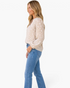 Beach Rose Co. beige blouse with cream floral texture, split neckline, and balloon sleeves worn with blue jeans