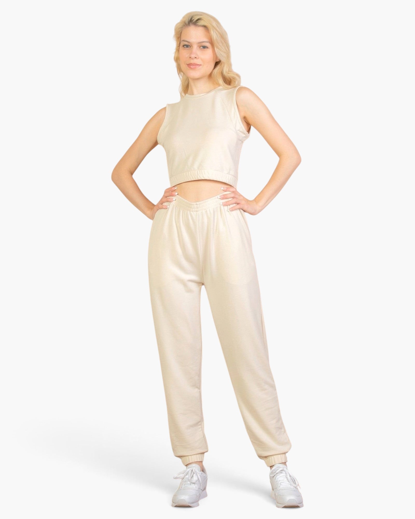 Beach Rose Co. beige French Terry tank top and joggers set worn by a blonde model with white sneakers