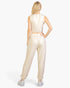 Beach Rose Co. beige French Terry tank top and joggers set worn by a blonde woman, back view.