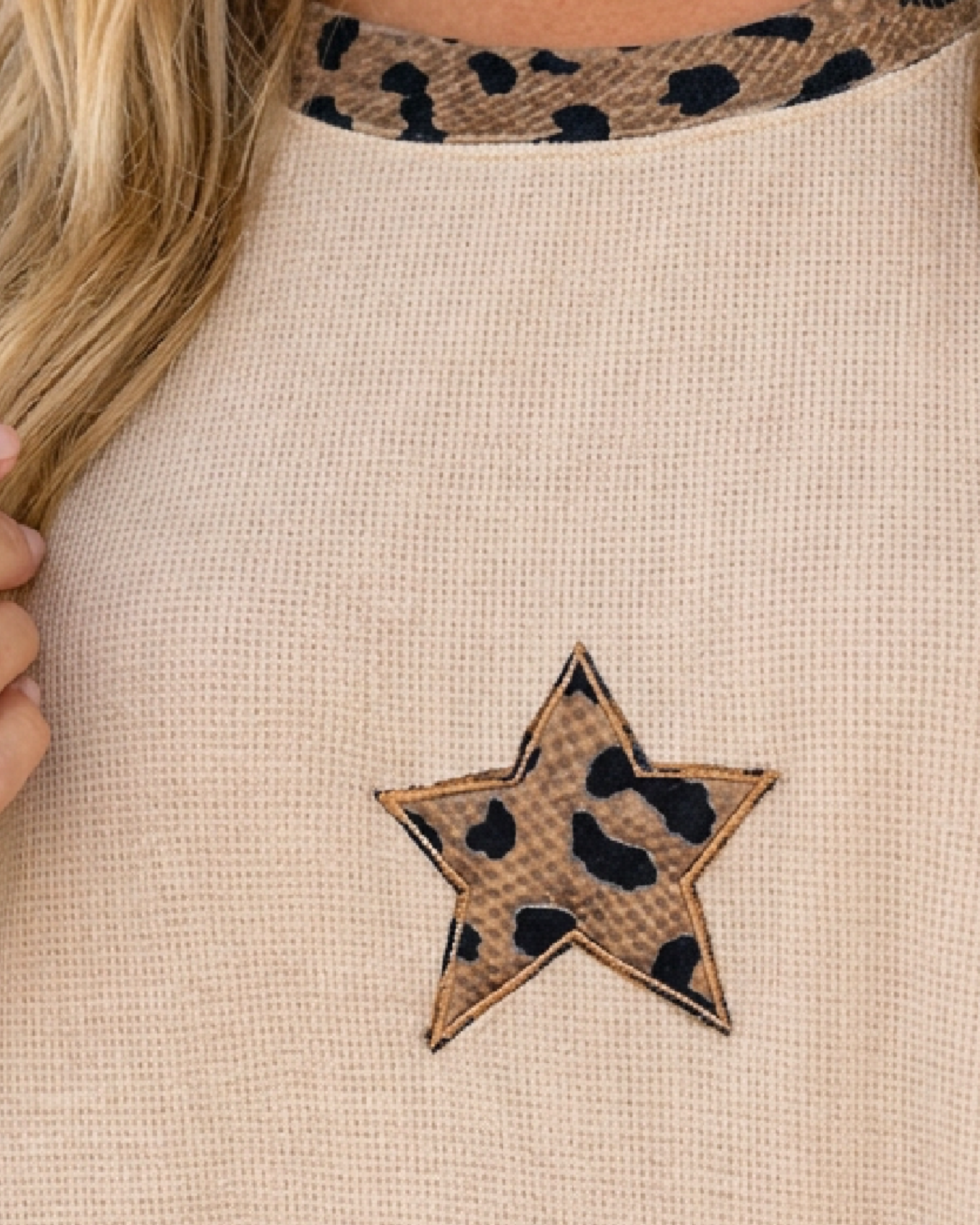 Beach Rose Co. beige waffle knit top featuring a leopard print star appliqué and matching leopard print neckline trim.