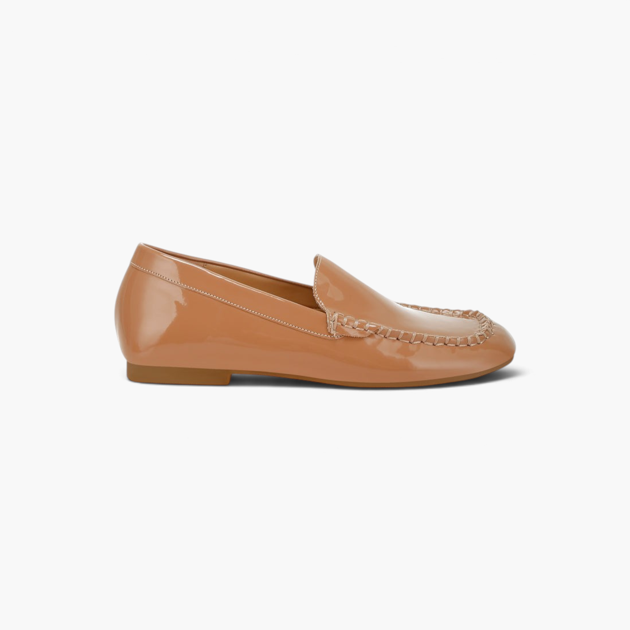 Beach Rose Co. beige patent pleather loafers with a round toe, mock stitching, and a flat heel.